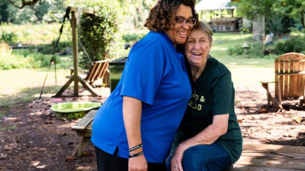 Two women sitting on a bench