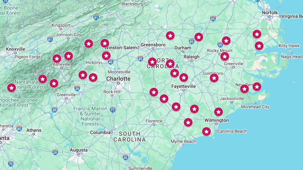 Map of North Carolina with red star markers indicating multiple locations across the state.