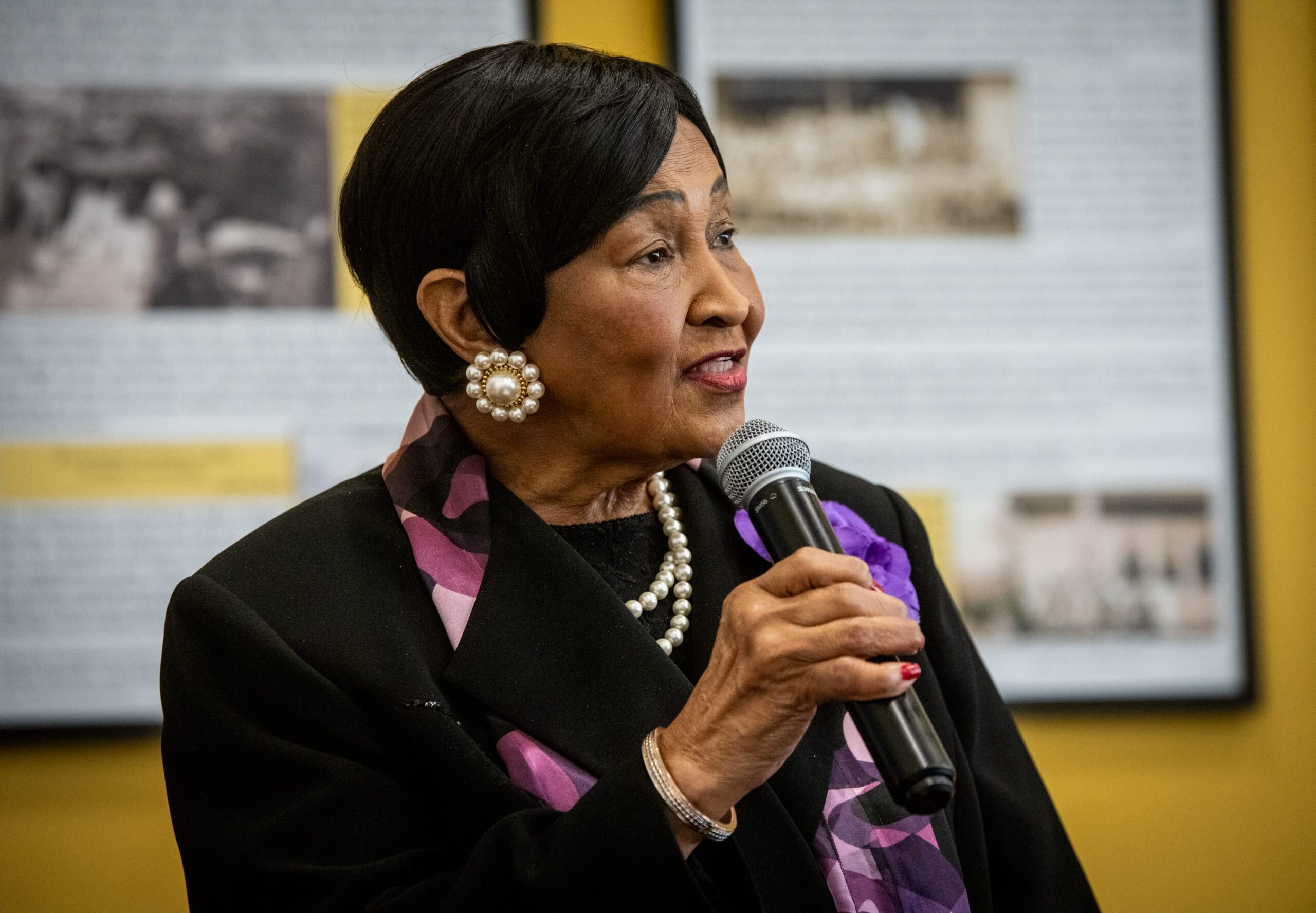 Edith Darity speaks into a microphone