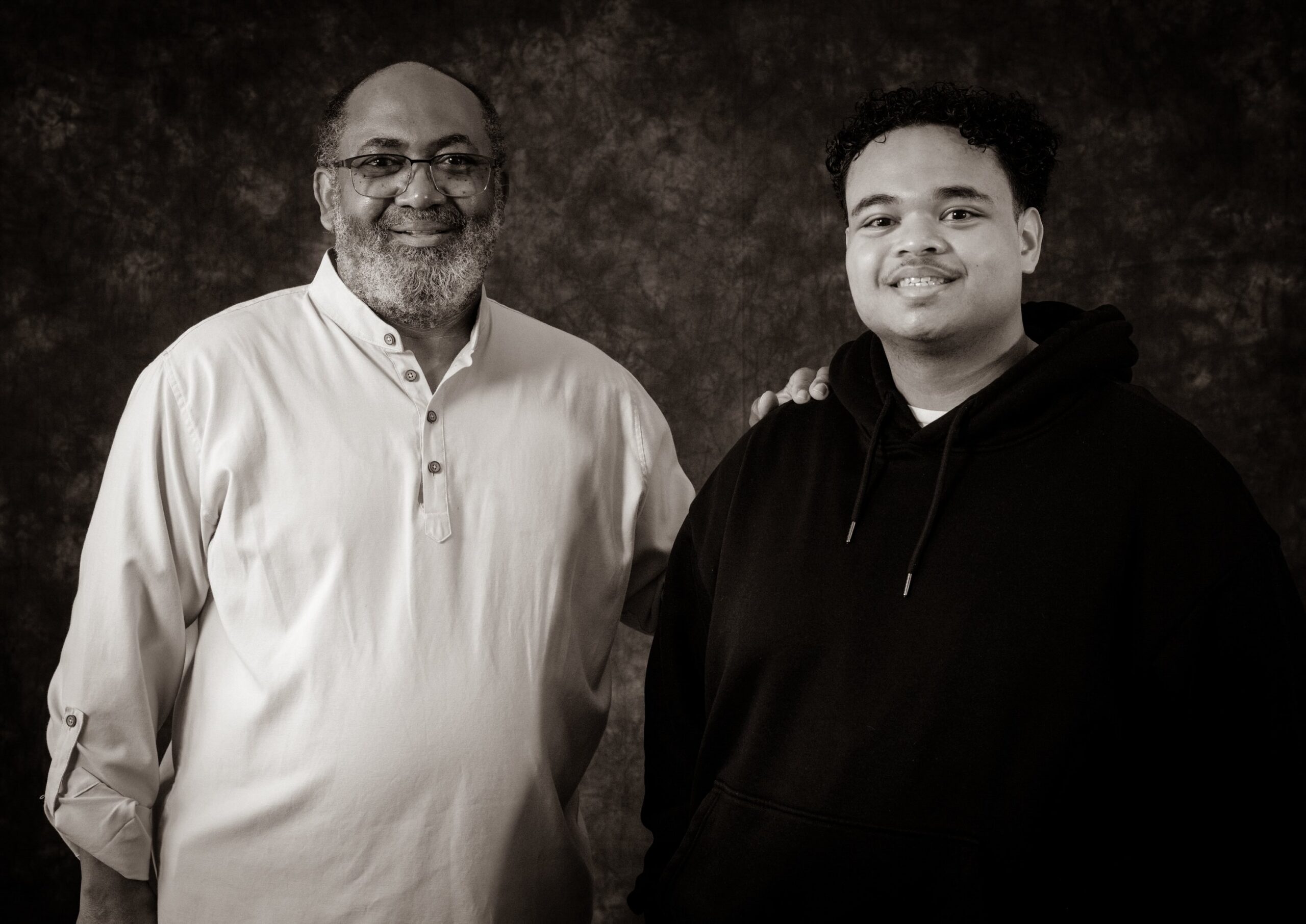 Rev. Victor Foster and his son Cyril stand for a portrait